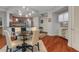 Bright dining area features modern lighting and hardwood floors at 200 River Vista Dr # 436, Atlanta, GA 30339