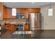 Modern kitchen featuring stainless steel appliances, dark granite countertops, and ample cabinet space at 200 River Vista Dr # 436, Atlanta, GA 30339