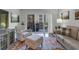 Living room showcasing chair with ottoman, sliding doors to balcony, and wood flooring at 200 River Vista Dr # 436, Atlanta, GA 30339