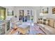 Cozy living room with hardwood floors, comfortable seating, and access to balcony at 200 River Vista Dr # 436, Atlanta, GA 30339