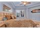 Relaxing main bedroom features a tray ceiling, ceiling fan, balcony access, and soothing color palette at 200 River Vista Dr # 436, Atlanta, GA 30339