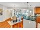 Bright open-concept space showcasing kitchen, dining, and living areas with hardwood floors at 200 River Vista Dr # 436, Atlanta, GA 30339