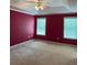 Spacious primary bedroom featuring large windows and carpeted flooring at 3218 Watson Woods Way, Loganville, GA 30052