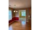 A dining area featuring hardwood floors, natural light, and a chandelier at 3218 Watson Woods Way, Loganville, GA 30052