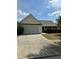 Charming single-story home featuring a two-car garage and well-maintained front yard at 3218 Watson Woods Way, Loganville, GA 30052
