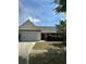 Single-story home featuring a well-maintained front lawn and tidy landscaping at 3218 Watson Woods Way, Loganville, GA 30052