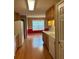 Traditional-style kitchen featuring wood cabinets, laminate floors, and natural light at 3218 Watson Woods Way, Loganville, GA 30052