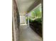 Side view of walkway featuring stone, shrubs, manicured mulch, and siding at 3218 Watson Woods Way, Loganville, GA 30052