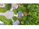 Aerial view of a home with a deck, surrounded by lush landscaping and a cul-de-sac at 4325 Acanthite Ct, Cumming, GA 30040