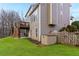 A spacious backyard with a deck, patio, fenced yard, and well-maintained landscaping at 4325 Acanthite Ct, Cumming, GA 30040