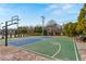 Well-maintained basketball court with new hoop, seating and landscaping under a blue sky at 4325 Acanthite Ct, Cumming, GA 30040
