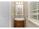 Charming bathroom with an updated vanity, vanity lighting and a window with natural light at 4325 Acanthite Ct, Cumming, GA 30040
