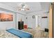 Bedroom features paintings, hardwood floors, and walk-in closet at 4325 Acanthite Ct, Cumming, GA 30040