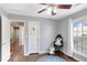 Bedroom with hardwood floors, a window with blinds, and a cozy chair at 4325 Acanthite Ct, Cumming, GA 30040