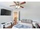 Bedroom features a dark ceiling fan, hardwood floors, and natural light at 4325 Acanthite Ct, Cumming, GA 30040