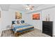 Bedroom features paintings, hardwood floors, and modern decor at 4325 Acanthite Ct, Cumming, GA 30040