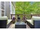 Relaxing deck with comfortable seating and a tiered water fountain with views of the yard at 4325 Acanthite Ct, Cumming, GA 30040
