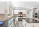Modern kitchen showcasing stainless steel appliances, ample countertop space, and an island with seating at 4325 Acanthite Ct, Cumming, GA 30040