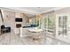 Open kitchen nook with table and chairs with views of the living room and outdoor deck at 4325 Acanthite Ct, Cumming, GA 30040