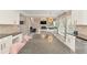 Extended kitchen island with dark countertops and view of the living area and kitchen nook at 4325 Acanthite Ct, Cumming, GA 30040