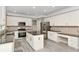 Modern kitchen featuring stainless steel appliances, dark countertops, and an island with seating at 4325 Acanthite Ct, Cumming, GA 30040
