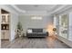 Elegant living room with hardwood flooring, chandelier lighting, and neutral decor at 4325 Acanthite Ct, Cumming, GA 30040
