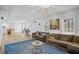 Basement living room with two sofas and a large blue rug at 4325 Acanthite Ct, Cumming, GA 30040