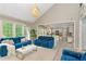 Open-concept living room flows seamlessly into a modern kitchen, creating a connected living space at 4325 Acanthite Ct, Cumming, GA 30040