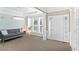 Stylish living room with a modern gray sofa, decorative lighting, and hardwood floors at 4325 Acanthite Ct, Cumming, GA 30040