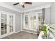 Inviting sitting room with hardwood flooring, natural light, and French doors at 4325 Acanthite Ct, Cumming, GA 30040