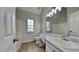 Bathroom featuring vinyl floors, large vanity mirror, and combined shower and tub at 64 Dogwood Rdg, Hampton, GA 30228