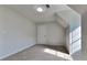 Cozy bedroom with neutral carpet, a large closet, and natural light at 64 Dogwood Rdg, Hampton, GA 30228
