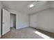 Cozy bedroom with plush carpet and neutral paint; features built-in closet at 64 Dogwood Rdg, Hampton, GA 30228