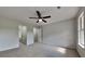 Bright bedroom with plush carpeting, neutral walls and ceilings, and an open closet area at 64 Dogwood Rdg, Hampton, GA 30228