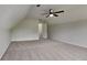 Large bedroom with plush carpeting, ceiling fan, and light-filled window at 64 Dogwood Rdg, Hampton, GA 30228