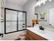 Modern bathroom featuring a vanity, shower with glass doors, and stylish decor at 109 Aspen Way, Dallas, GA 30157