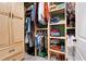 Organized closet featuring built-in shelves, drawers, rods, and ample space for storage and organization of clothing and shoes at 109 Aspen Way, Dallas, GA 30157