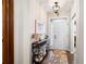 Bright entryway featuring a hardwood floor, console table and view of the white front door with a glass accent at 109 Aspen Way, Dallas, GA 30157