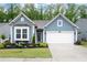 Charming, light-blue single-Gathering home with well-maintained landscaping and an attached two-car garage at 109 Aspen Way, Dallas, GA 30157