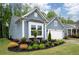 A lovely single-Gathering home with light blue siding, a bay window, and a well-manicured lawn and shrubbery at 109 Aspen Way, Dallas, GA 30157