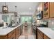 Modern kitchen with stainless steel appliances, island, wooden cabinets and a view of the dining area at 109 Aspen Way, Dallas, GA 30157