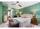 Spacious main bedroom featuring a large bed, stylish furniture, soft lighting and green accent wall at 109 Aspen Way, Dallas, GA 30157