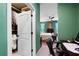 View of closet with clothing and shelves leading to a bedroom with a ceiling fan and neutral color palette at 109 Aspen Way, Dallas, GA 30157