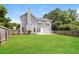 Expansive backyard with a lush green lawn and privacy fence, perfect for outdoor activities and relaxation, offering great potential at 194 Wilhelmina Dr, Austell, GA 30168