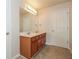 Well-lit bathroom with double vanity, ample cabinet space, tile floor, and bright countertop, creating an organized space at 194 Wilhelmina Dr, Austell, GA 30168