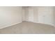 Neutral bedroom with carpeted floor and multiple doors at 194 Wilhelmina Dr, Austell, GA 30168