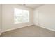 Light and airy bedroom with a window and neutral walls and carpet at 194 Wilhelmina Dr, Austell, GA 30168