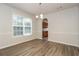 Sunlit dining room featuring sleek floors and modern wainscoting at 194 Wilhelmina Dr, Austell, GA 30168