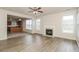 Open-concept living room with fireplace flows into modern kitchen at 194 Wilhelmina Dr, Austell, GA 30168