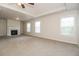 Spacious living room featuring a cozy fireplace and abundant natural light from multiple windows at 194 Wilhelmina Dr, Austell, GA 30168